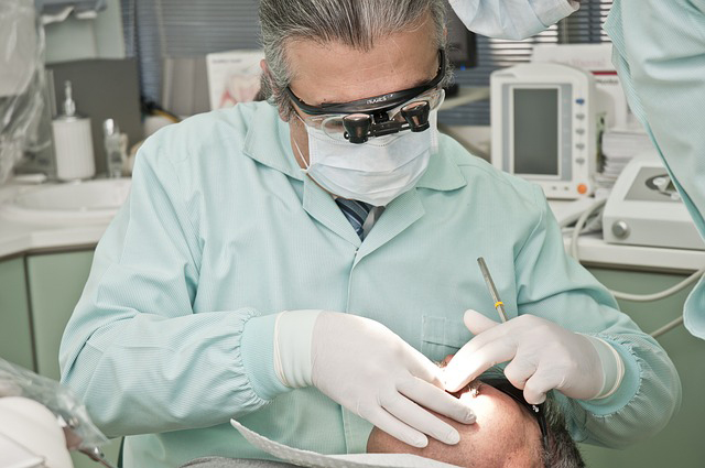 Dentist performing a dental implant in Broomfield CO